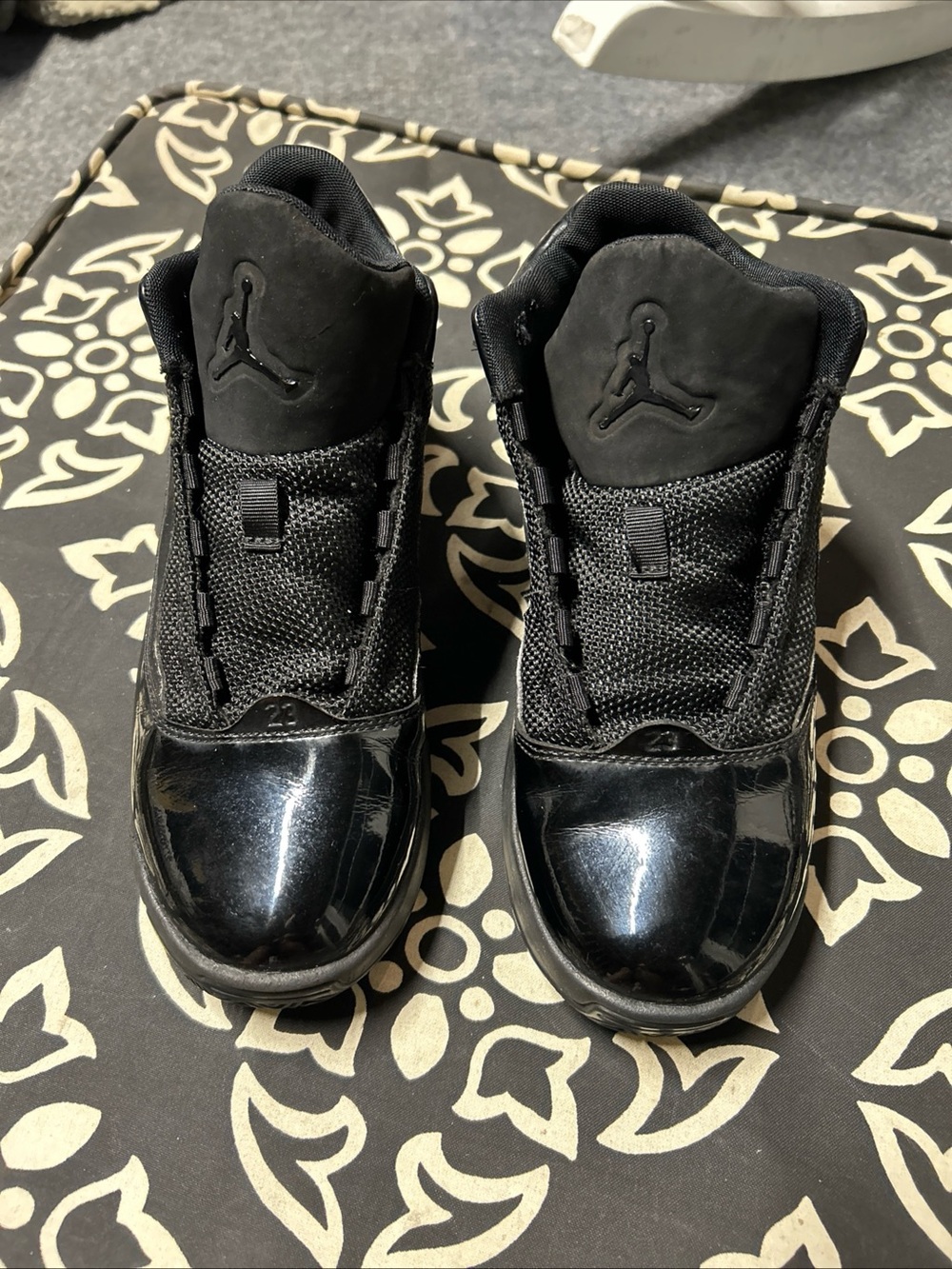 Air Jordans triple black aura sneakers for kids